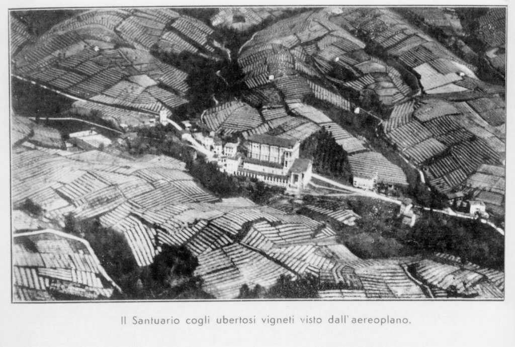 A photograph taken from an airplane in 1930 of the Santuario del Santissimo Crocifisso in Boca surrounded by hundreds of acres of grape vines.