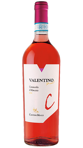 A photograph highlighting the bright red color of Cantine Mucci's Valentino Cerasuolo d'Abruzzo rose wine bottle