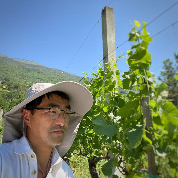 A photo of Andrea Peloso in one of his many vineyards.